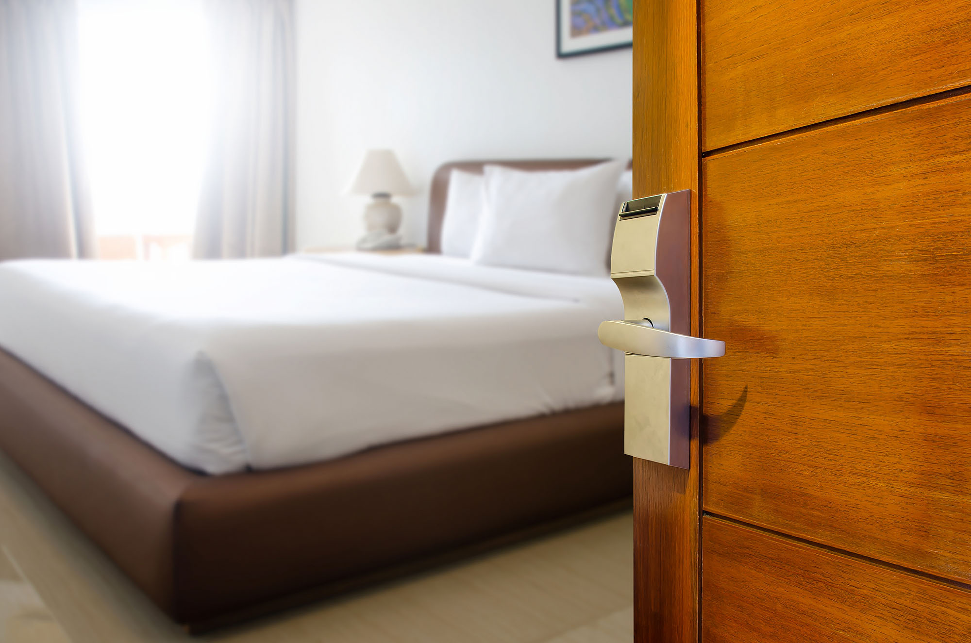 hotel-bed-open-door-sunny