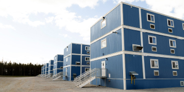 Workforce housing camp in remote wooded area.