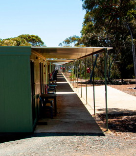 Corridor lining bedroom doors at a remote mining camp.