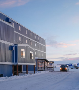 Modern remote workforce housing facility in winter located in Alaska.