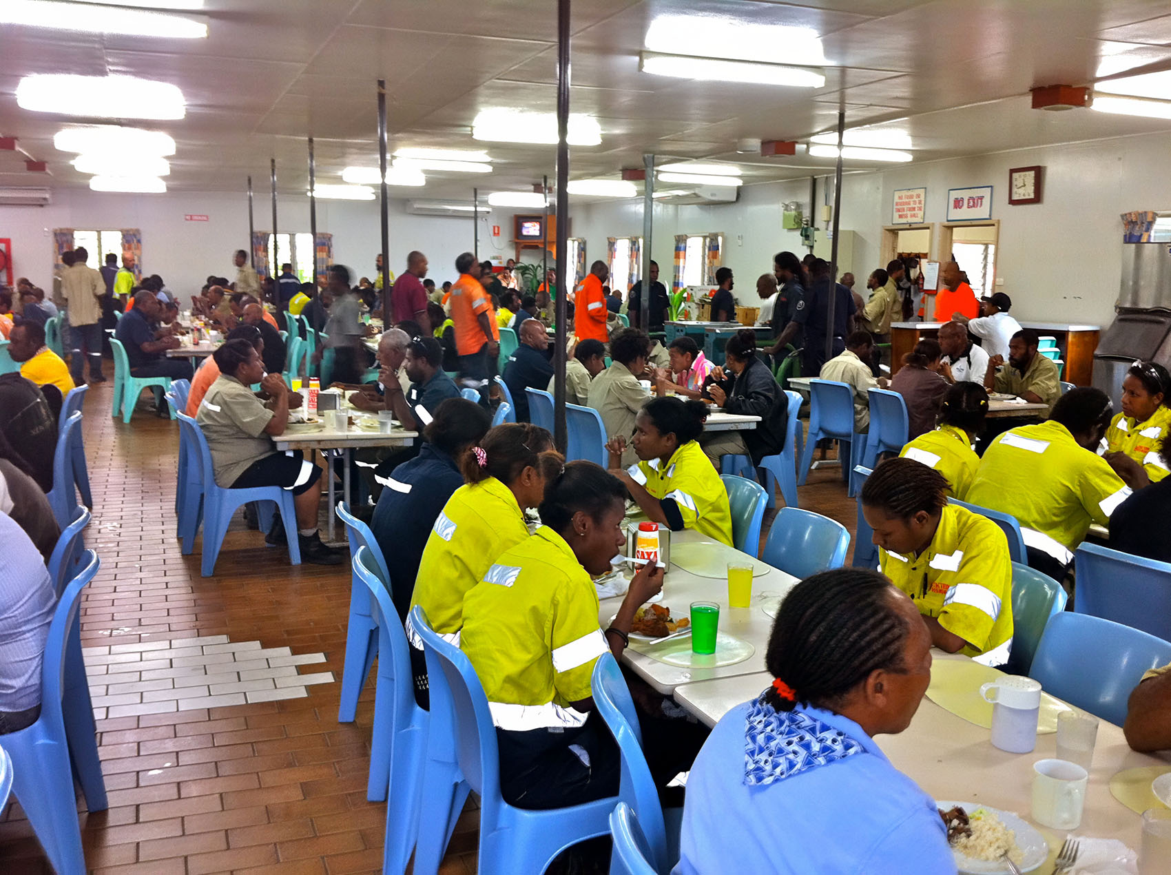 Fly-in fly-out workers in west Africa eat lunch at a messing hall in a modular structure