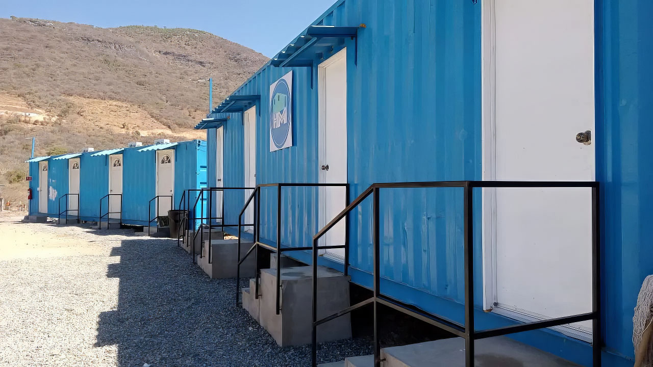 Side view of worker rooms at mining camp at base of mountain in Chile.